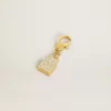 Breloque en forme de cadenas en laiton doré avec cristaux Breloque en forme de cadenas en laiton doré avec cristaux