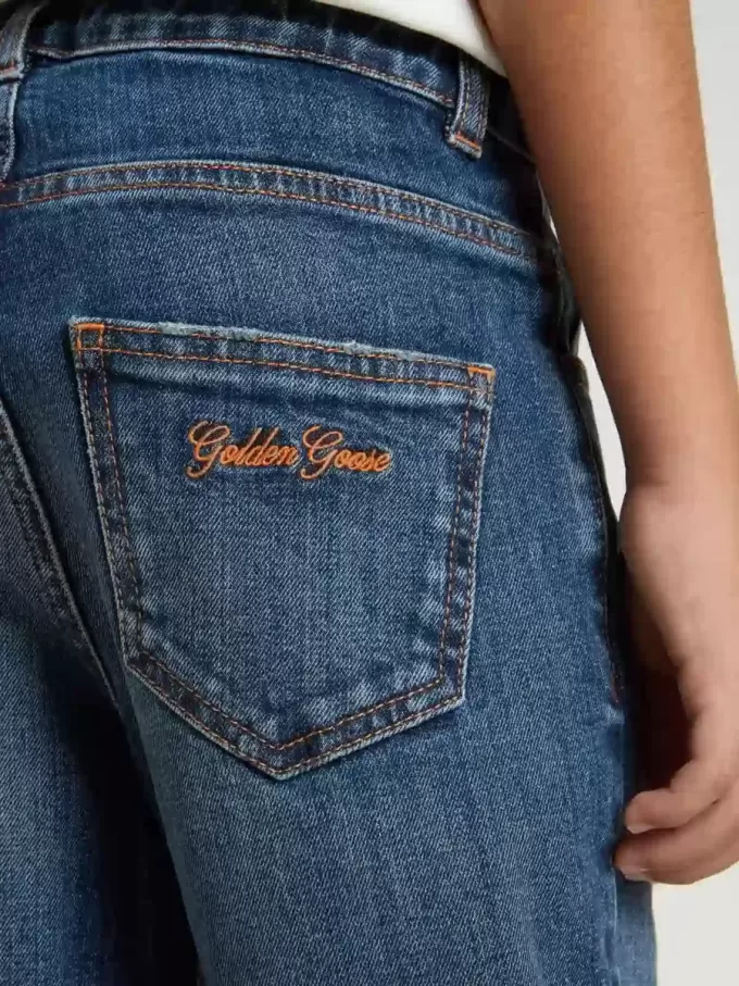 Jean pour garçon avec bord brut et broderies