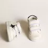 Junior June en cuir nappa avec étoile et languette au talon en daim bleu foncé