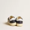 Junior May en cuir blanc et bleu avec étoile et languette au talon en cuir