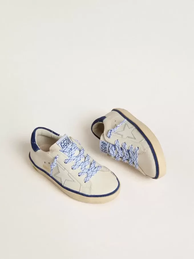 Junior Super-Star en cuir blanc avec talon en daim bleu Junior Super-Star en cuir blanc avec talon en daim bleu