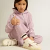 Modèle Junior May School en cuir avec étoile pailletée et languette au talon Modèle Junior May School en cuir avec étoile pailletée et languette au talon