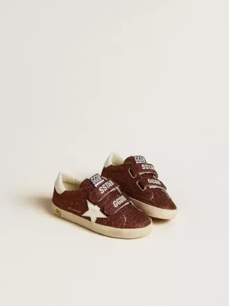 Modèle Old School Junior bordeaux pailleté avec étoile et languette au talon en cuir Modèle Old School Junior bordeaux pailleté avec étoile et languette au talon en cuir