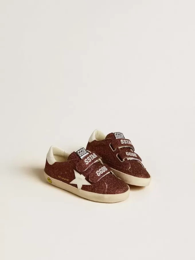 Modèle Old School Junior bordeaux pailleté avec étoile et languette au talon en cuir Modèle Old School Junior bordeaux pailleté avec étoile et languette au talon en cuir