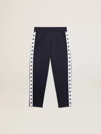 Pantalon de jogging bleu foncé avec bande blanche et étoiles contrastées