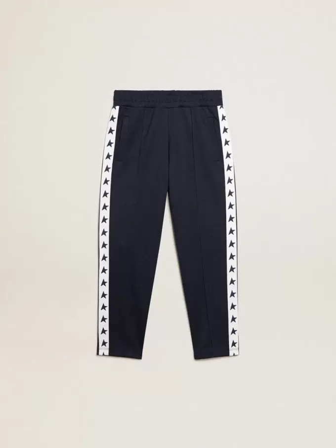 Pantalon de jogging bleu foncé avec bande blanche et étoiles contrastées