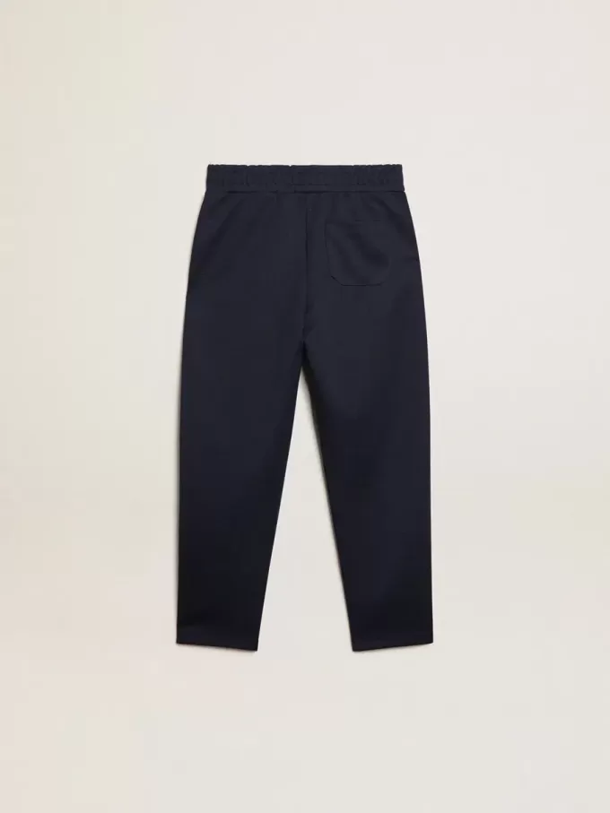 Pantalon de jogging bleu foncé avec bande blanche et étoiles contrastées