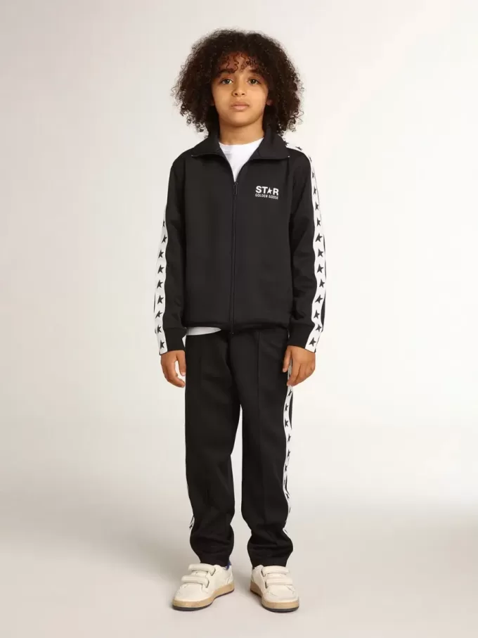 Pantalon de jogging bleu foncé avec bande blanche et étoiles contrastées
