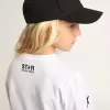 T-shirt blanc à manches longues avec étoiles noires contrastées