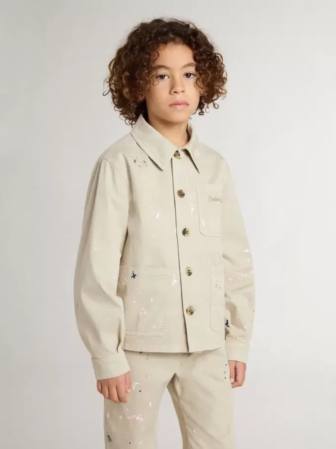 Veste beige pour enfant avec éclaboussures multicolores Veste beige pour enfant avec éclaboussures multicolores