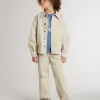 Veste beige pour enfant avec éclaboussures multicolores Veste beige pour enfant avec éclaboussures multicolores