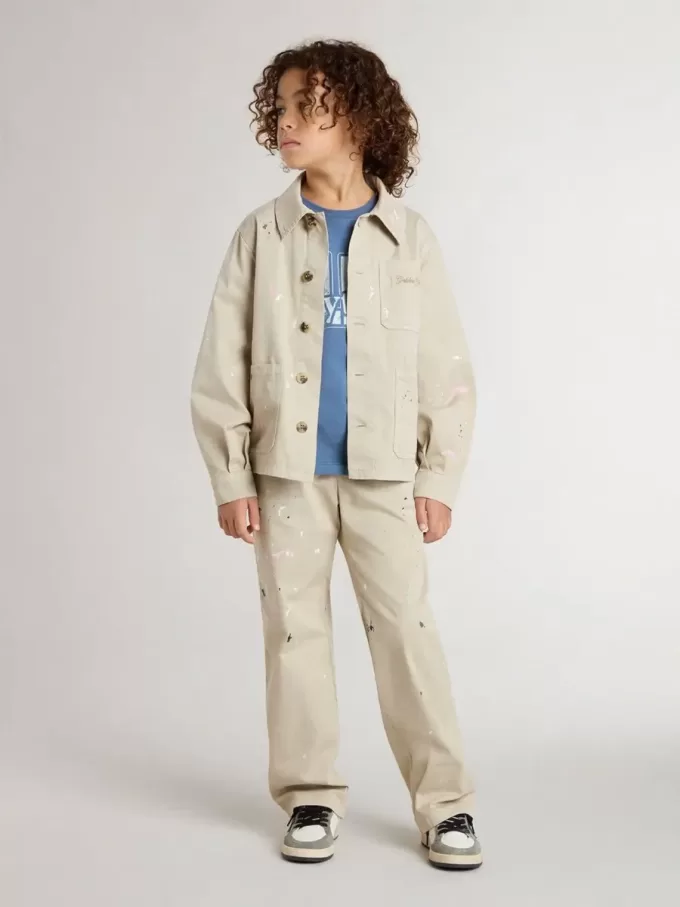 Veste beige pour enfant avec éclaboussures multicolores Veste beige pour enfant avec éclaboussures multicolores