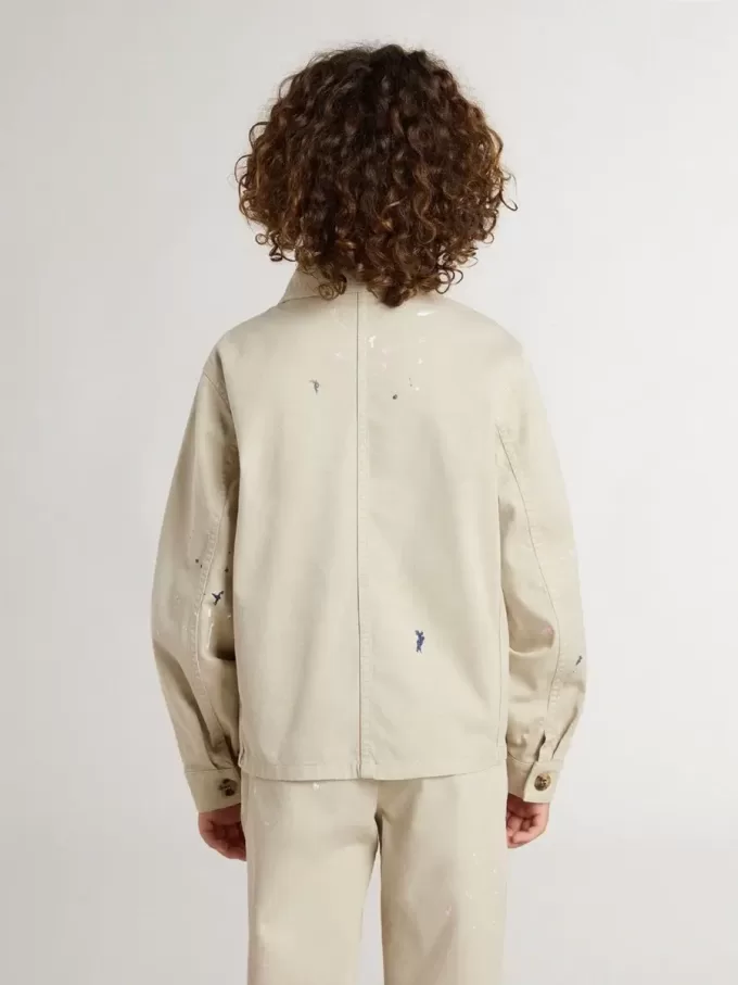 Veste beige pour enfant avec éclaboussures multicolores Veste beige pour enfant avec éclaboussures multicolores