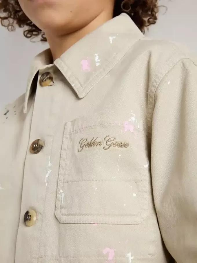 Veste beige pour enfant avec éclaboussures multicolores Veste beige pour enfant avec éclaboussures multicolores